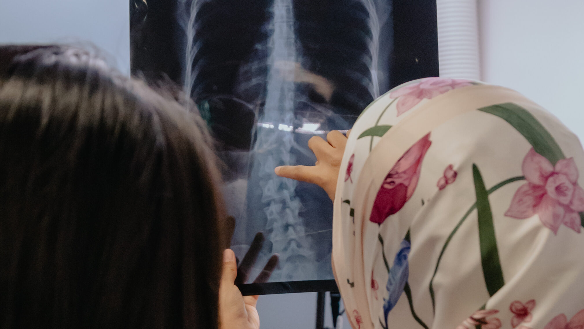 Spinal examination for scoliosis patient at chiropractic singapore