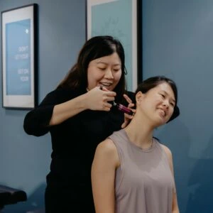 Chiropractor in Singapore applying a diversified technique adjustment to the spine