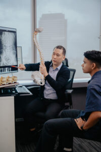 Gamer doing a Spinal Assessment