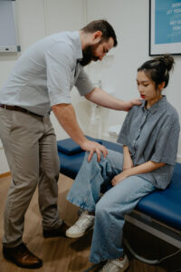 Chiropractor providing guided exercises
