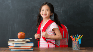 Young girl with school bag