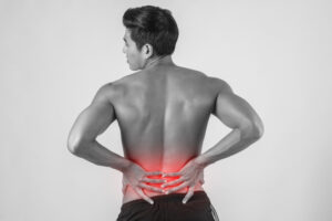 Close up of man rubbing his painful back