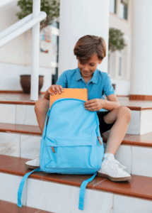 Young boy with school bag