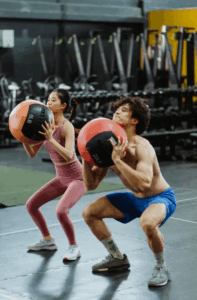Asian couple exercising at the gym