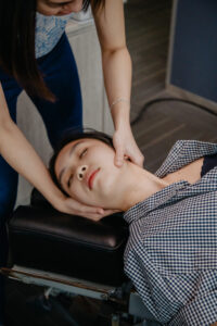 Chiropractor adjusting patient's neck