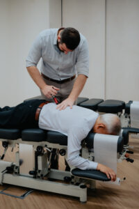 Chiropractor adjusting a patient